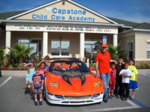 TJ Kmetz with his 2000 Extreme Corvette, sharing it with the kids at the day care he works for.